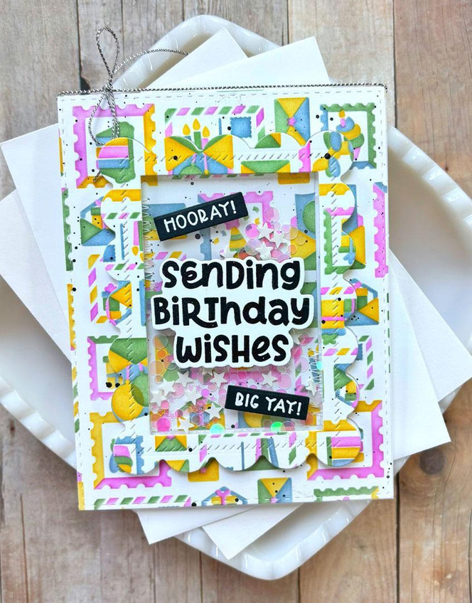 Handmade greeting card with birthday envelopes on it and sending birthday wishes sentiment on it.