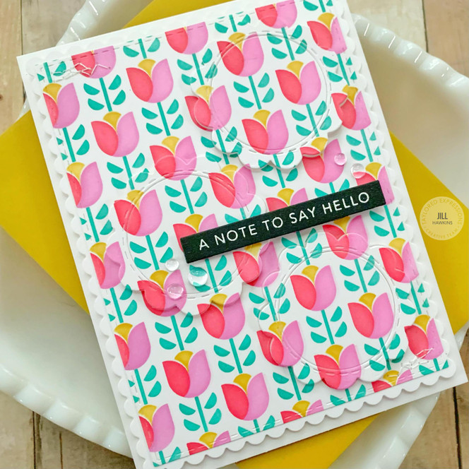 Handmade greeting card with flowers on it and a note to say hello sentiment on it.