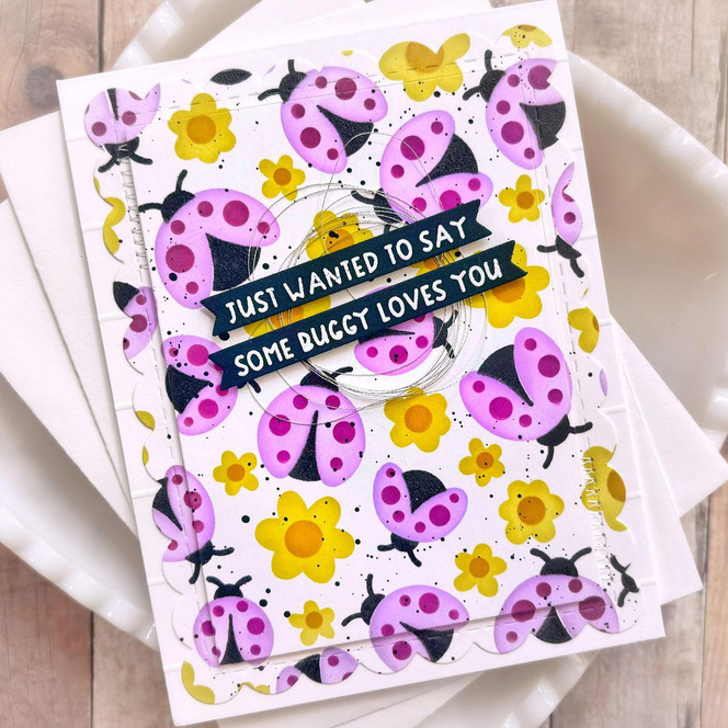 Handmade greeting card with lady bugs and flowers on it with just wanted to say some buggy loves you sentiment on it.