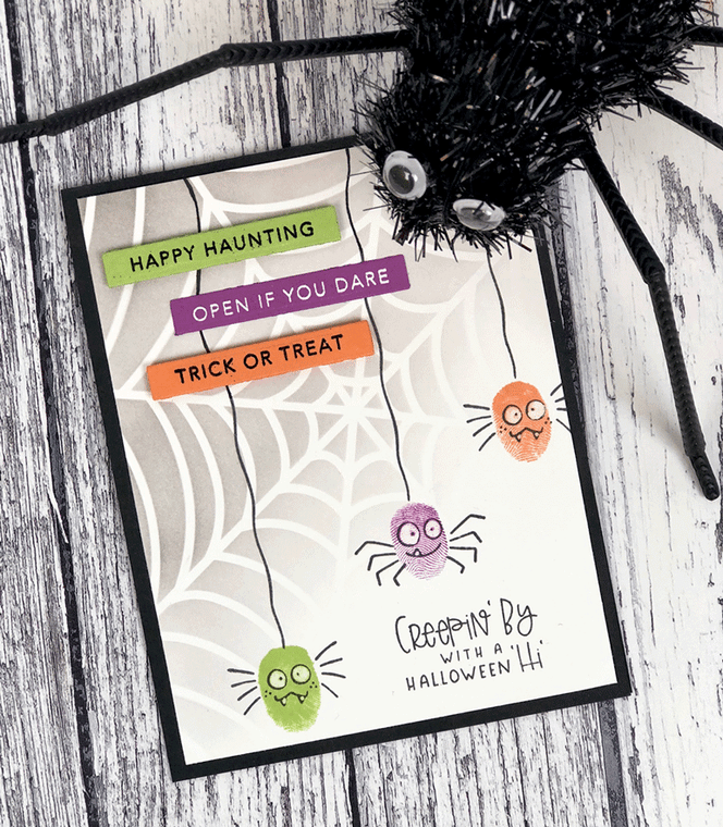 Handmade greeting card with spiders on it with halloween sentiments on it.