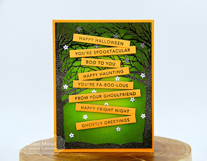 Handmade greeting card with spooky trees on it and multiple halloween sentiments on it.