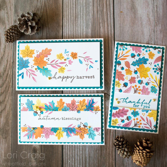 Three handmade greeting cards with fall leaves on them with different autumn sentiments on each.