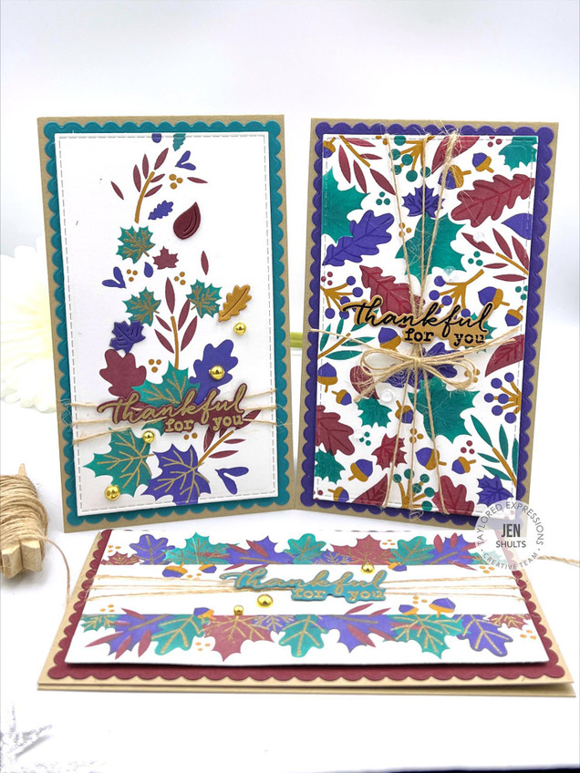 Three handmade greeting cards with fall leaves on each and thankful sentiments on each.