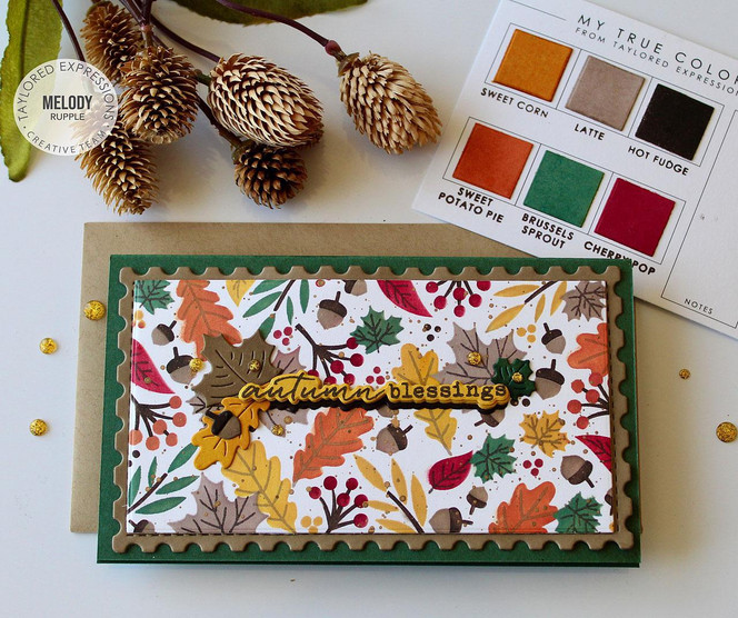 Handmade greeting card with leaves on it and autumn blessings sentiment on it.