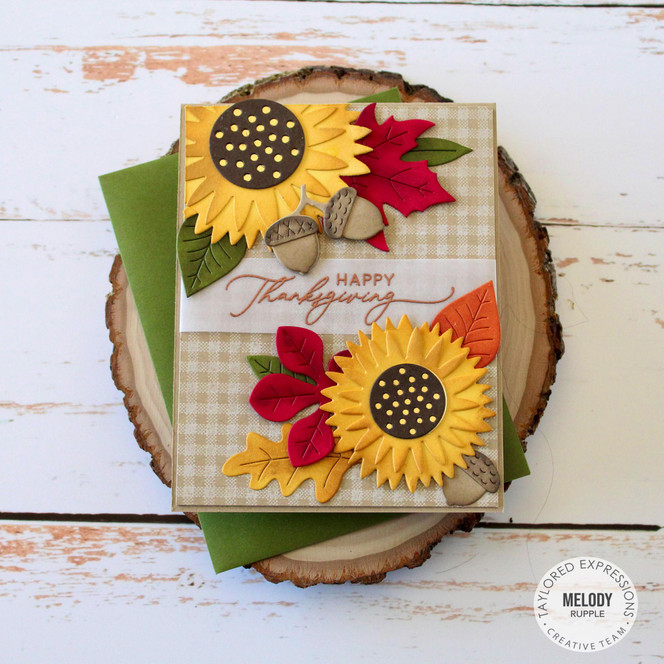 Handmade greeting card with sunflowers on it and acorns with happy thanksgiving sentiment on it.