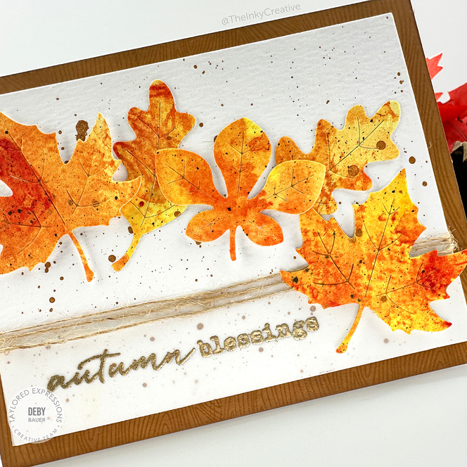 Handmade greeting card with leaves on it and autumn blessings sentiment on it.