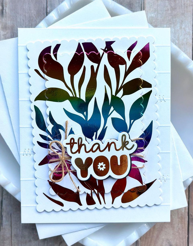 Handmade greeting card with leaves on it and thank you sentiment on it.