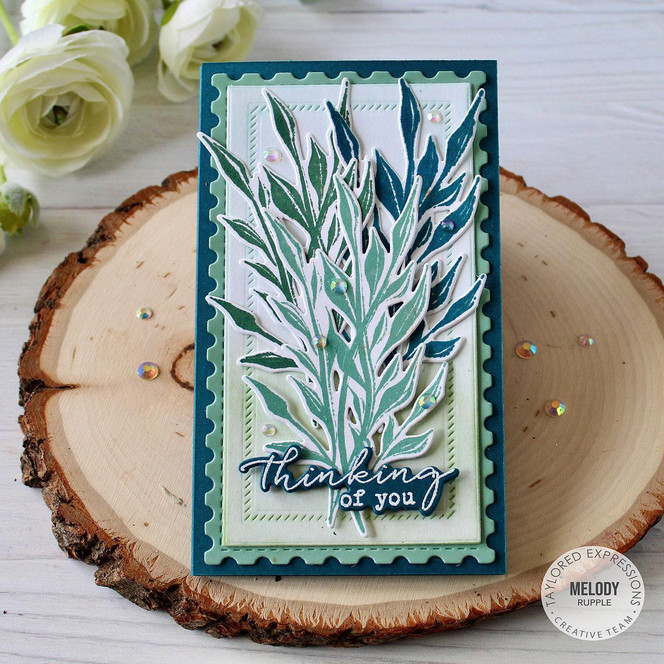 Handmade greeting card with flowers on it and thinking of you sentiment on it.