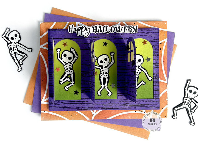 Handmade greeting card with dancing skeletons on it with happy halloween sentiment on it.