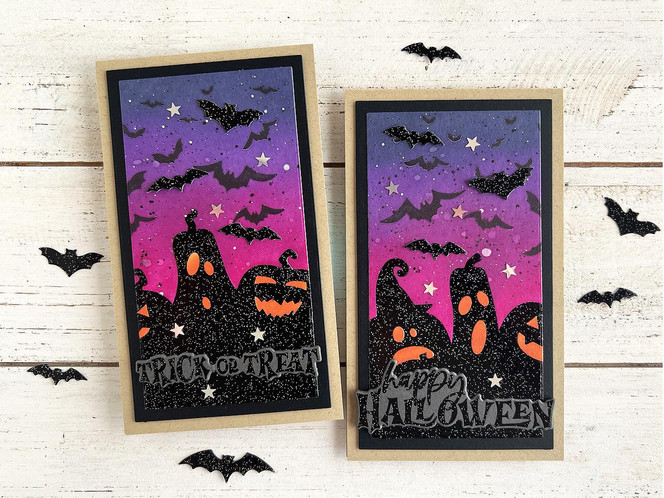 Two handmade greeting cards with pumpkins and bats on each with one having trick or treat sentiment on it and the other having happy halloween sentiment on it.