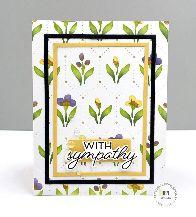 Handmade greeting card with flowers on it and with sympathy sentiment on it.
