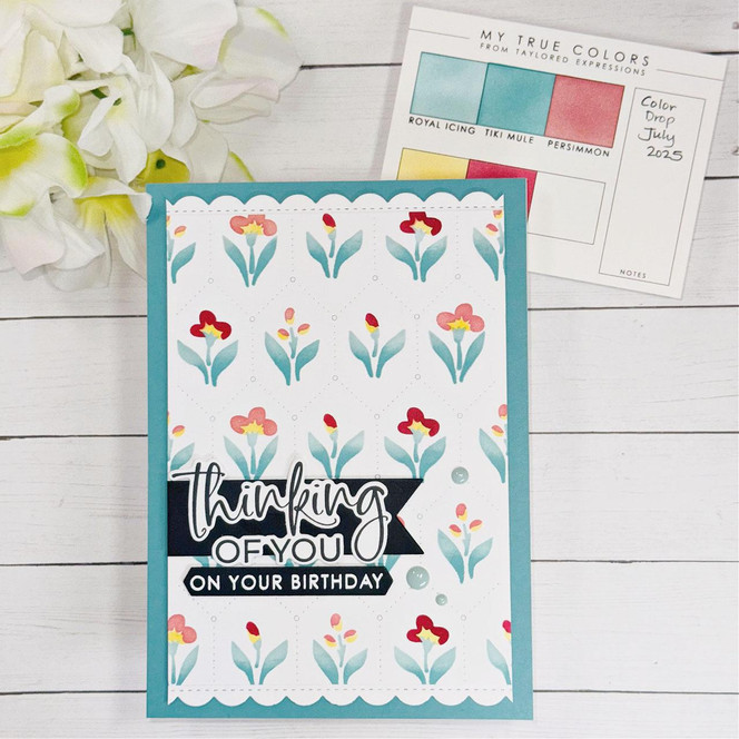 Handmade greeting card with flowers on it and thinking of you on your birthday sentiment on it.