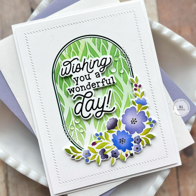 Handmade greeting card with oval of flowers and wishing you a wonderful day sentiment on it.