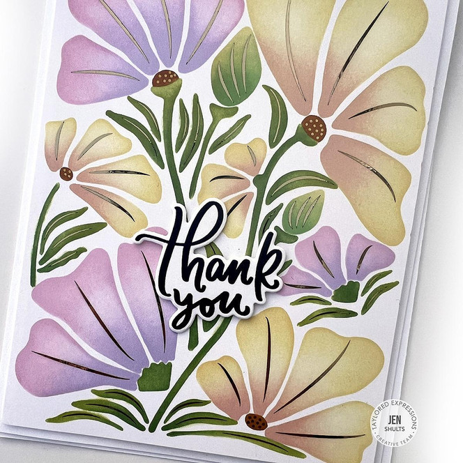 Handmade greeting card with flowers on it and thank you sentiment on it.