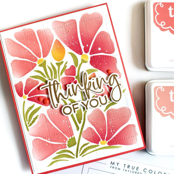 Handmade greeting card with flowers on it and thinking of you sentiment on it.