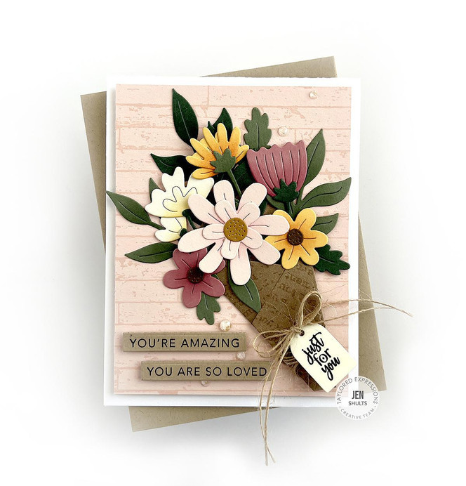Handmade greeting card with bouquet of flowers on it with you're amazing sentiment on it and you are so loved sentiment on it.