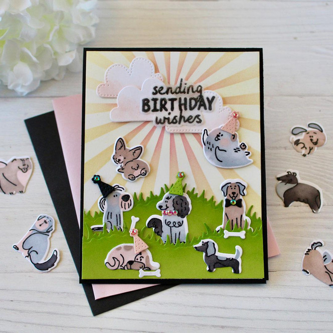 Handmade greeting card with dogs on it with bones and sending birthday wishes sentiment on it.