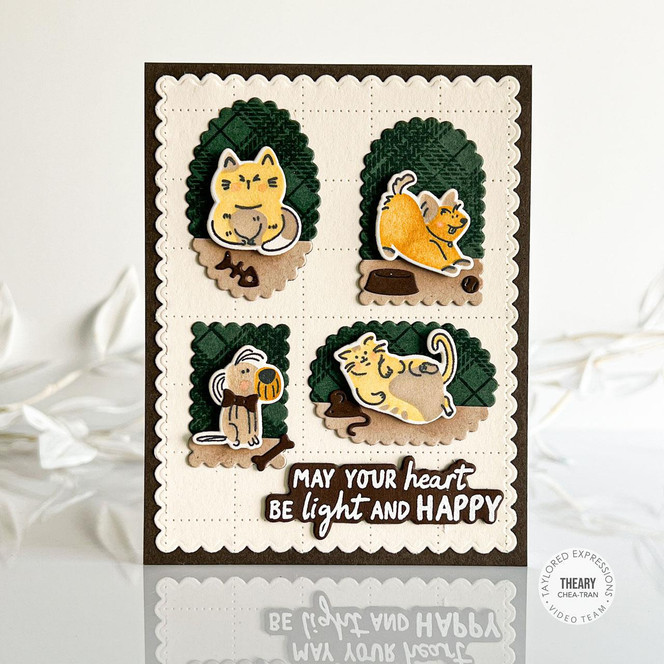 Handmade greeting card with dogs and cats on i with may your heart be light and happy sentiment on it.
