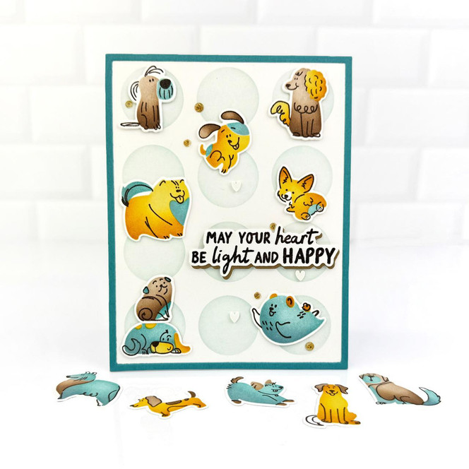 Handmade greeting card with dogs playing on it and may your heart be light and happy sentiment on it.