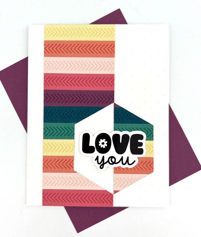 Handmade greeting card with colorful strips on it and love you sentiment on it.