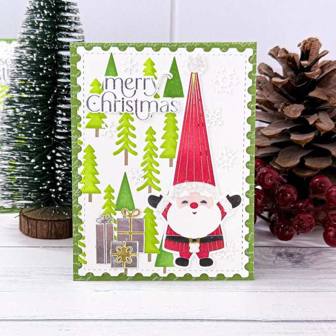 Handmade greeting card with santa on it and merry christmas sentiment on it.