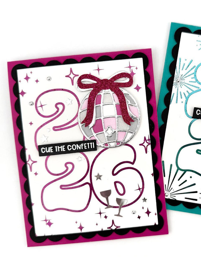 Two handmade greeting cards with 2026 on them and disco balls with different New Year sentiments on them.