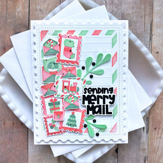 Handmade greeting card with Christmas postage with sending merry mail sentiment on it.