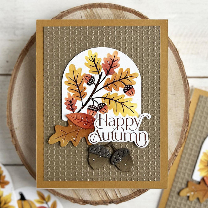 Handmade greeting card with leaves on it and happy autumn sentiment on it.