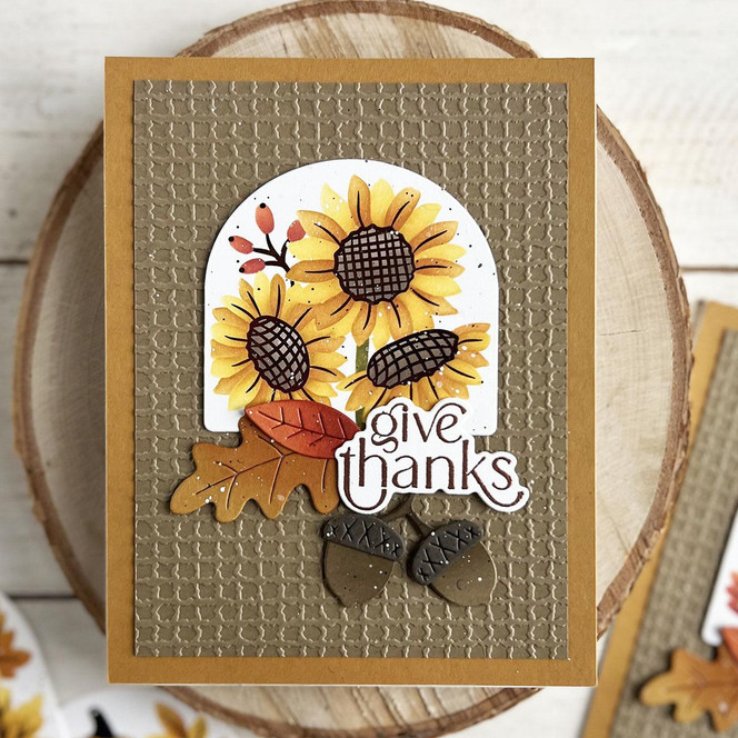 Handmade greeting card with sunflowers on it and give thanks sentiment on it.