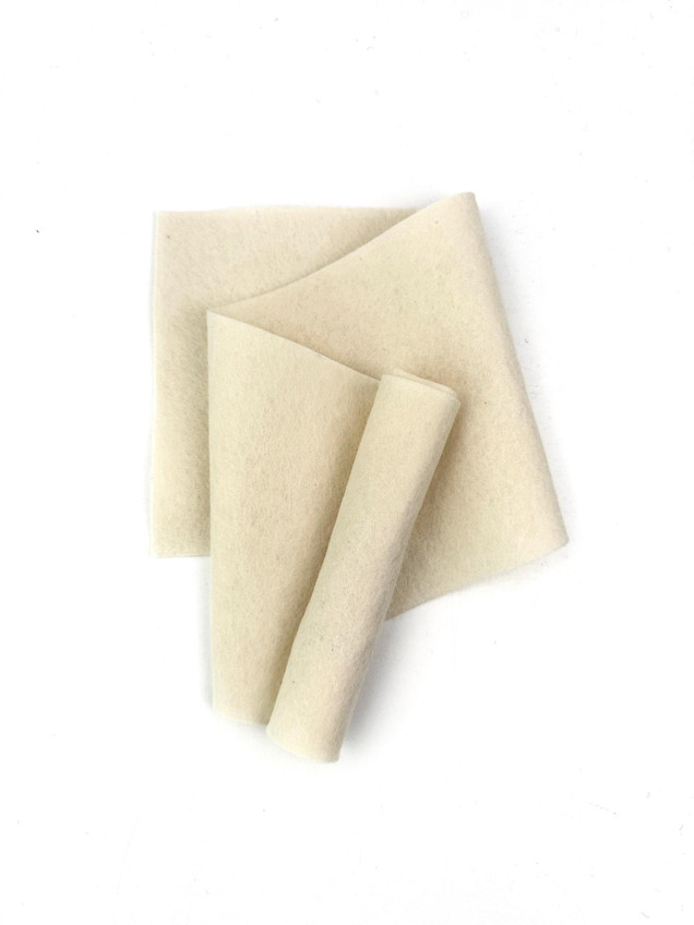 Image of 100% wool felt buttercream frosting which is a white colored felt for papercrafting.