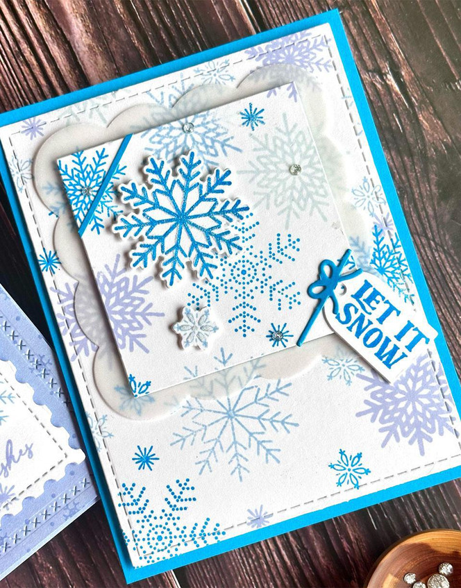 Handmade greeting card with snowflakes on it and let it snow sentiment on it.