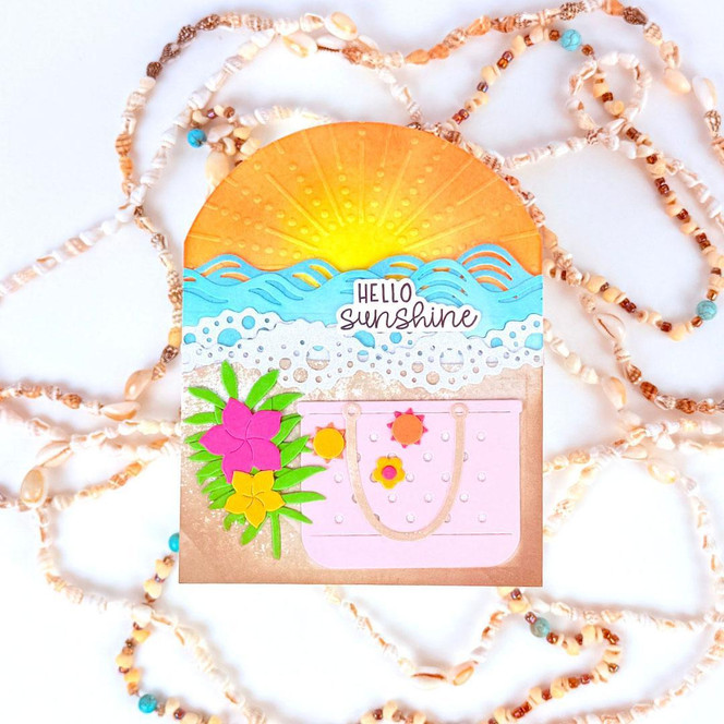 Handmade greeting card with beach themed items on it and hello sunshine sentiment on it.