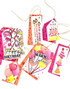 Handmade greeting tags with balloons on it and party hats.