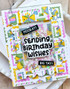 Handmade greeting card with birthday envelopes on it and sending birthday wishes sentiment on it.