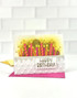 Handmade greeting card with candles on it and happy birthday sentiment on it.
