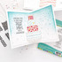 Inside of a handmade greeting card with cake on it and wishing you a birthday piled high with happiness sentiment on it.