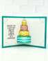 Inside of a handmade greeting card with cake in it and wishing you a birthday piled high with happiness sentiment on it.