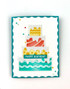 Handmade greeting card with cake on it and and happy birthday sentiment on it.