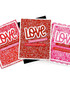 Three handmade greeting cards with love sentiment on each of them.