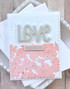 Handmade greeting card with hearts on it and love is in the air sentiment on it.