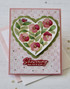 Handmade greeting card with floral heart on it and showering you with love sentiment on it.