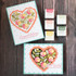 Two handmade greeting cards with floral hearts on each and a congratulations and best wishes sentiment on each.