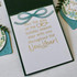 Inside of a greeting card with may the joy of the holiday season stay with you throughout the new year sentiment on it.