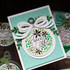 Handmade greeting card with ornament on it and peace on earth sentiment on it.