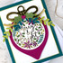 Handmade greeting card with ornament on it and merry & bright sentiment on it.