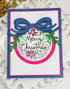 Handmade greeting card with ornament on it and Merry Christmas sentiment on it.