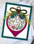 Handmade greeting card with ornament on it and merry & bright sentiment on it.