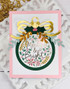 Handmade greeting card with ornament on it and Merry & Bright sentiment on it.