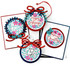Four handmade greeting cards and tags with ornaments and various Christmas sentiments on each.