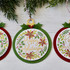 Handmade ornament tag with happy holidays sentiment on it.